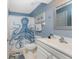 Bathroom with octopus shower curtain and white vanity at 13511 Foresman Blvd, Port Charlotte, FL 33981