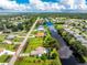 Aerial view of property highlighting its canal-side location and backyard at 13511 Foresman Blvd, Port Charlotte, FL 33981