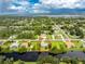 Aerial view of a single-Gathering home with a canal-front lot at 13511 Foresman Blvd, Port Charlotte, FL 33981