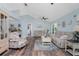 Open living area with hardwood floors, neutral tones, and coastal-inspired furnishings at 13511 Foresman Blvd, Port Charlotte, FL 33981