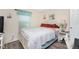 Bedroom with white bed frame and coastal decor at 13511 Foresman Blvd, Port Charlotte, FL 33981