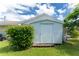 White shed offering extra storage space in the backyard at 13511 Foresman Blvd, Port Charlotte, FL 33981