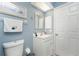 Clean and bright bathroom with a single vanity and updated fixtures at 13511 Foresman Blvd, Port Charlotte, FL 33981