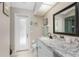 Clean bathroom with granite countertop and updated vanity at 13511 Foresman Blvd, Port Charlotte, FL 33981