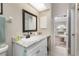 Bathroom with granite countertop sink and a view of bedroom at 13511 Foresman Blvd, Port Charlotte, FL 33981