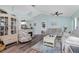 Living room showcasing vaulted ceilings, hardwood floors, and an electric fireplace at 13511 Foresman Blvd, Port Charlotte, FL 33981