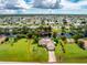 Bird's eye view of single-Gathering home, showcasing its canal-front location at 13511 Foresman Blvd, Port Charlotte, FL 33981