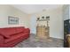 Living room with red couch and wicker cabinet at 13511 Foresman Blvd, Port Charlotte, FL 33981