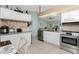 Bright kitchen with stainless steel appliances and granite countertops at 13511 Foresman Blvd, Port Charlotte, FL 33981