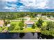 An aerial view showcasing a single-story house with a private pool at 13511 Foresman Blvd, Port Charlotte, FL 33981