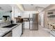 Eat-in kitchen with stainless steel appliances and granite countertops at 13511 Foresman Blvd, Port Charlotte, FL 33981