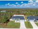 Aerial view of two houses with fenced yards, showcasing a desirable location and curb appeal at 13172 Gorman Ave, Port Charlotte, FL 33981