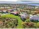 Aerial view showcasing the property's waterfront location in a desirable community at 13534 Eagle Pointe Dr, Port Charlotte, FL 33953