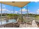Spacious screened lanai overlooking the golf course and lake at 10055 Links Ln # 206, Rotonda West, FL 33947