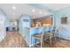 Kitchen breakfast bar with three light brown stools at 10055 Links Ln # 206, Rotonda West, FL 33947