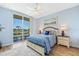 Spacious bedroom with a view and access to a balcony at 10055 Links Ln # 206, Rotonda West, FL 33947