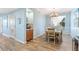 Bright dining room with wood floor and a chandelier at 10055 Links Ln # 206, Rotonda West, FL 33947