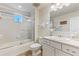 Clean bathroom with tub, shower, and updated vanity at 10055 Links Ln # 206, Rotonda West, FL 33947