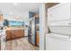 Kitchen with stainless steel appliances and laundry closet at 10055 Links Ln # 206, Rotonda West, FL 33947