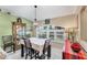Charming dining area with table and chairs near a large window at 2555 Dixon Ter, Port Charlotte, FL 33981