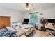Functional bedroom with twin beds and a workspace at 2555 Dixon Ter, Port Charlotte, FL 33981