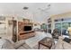 Spacious living room with comfortable seating, a large TV, and access to the patio at 2555 Dixon Ter, Port Charlotte, FL 33981