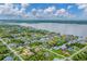 Aerial view of waterfront property with canal access and lush landscaping at 2555 Dixon Ter, Port Charlotte, FL 33981