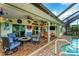 Spacious patio with pool access, comfortable seating, and open floor plan at 2555 Dixon Ter, Port Charlotte, FL 33981