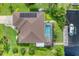 An elevated view showcases the home, pool, and private dock at 2555 Dixon Ter, Port Charlotte, FL 33981
