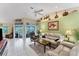 Open living area with vaulted ceilings, tiled floors, and ample natural light at 2555 Dixon Ter, Port Charlotte, FL 33981