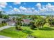 Single-story home with a large yard, showcasing curb appeal and landscaping at 2555 Dixon Ter, Port Charlotte, FL 33981