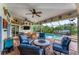 Relaxing poolside patio with seating and canal views at 2555 Dixon Ter, Port Charlotte, FL 33981