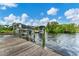 Private dock with covered boat slips on a tranquil waterway at 2555 Dixon Ter, Port Charlotte, FL 33981