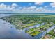 Bird's-eye view of the house and surrounding area, showcasing waterfront location at 2555 Dixon Ter, Port Charlotte, FL 33981
