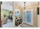 Bright and spacious entryway with tiled floors and a decorative front door at 2555 Dixon Ter, Port Charlotte, FL 33981