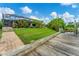 Spacious backyard with a dock and lush landscaping leading to the canal at 2555 Dixon Ter, Port Charlotte, FL 33981