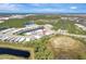 Aerial view of community with lake and homes at 1337 Sorrell Way, North Port, FL 34289