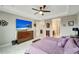 Main bedroom with king bed, dresser and bathroom access at 1337 Sorrell Way, North Port, FL 34289