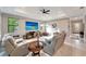 Spacious living room with sectional sofa and large screen TV at 1337 Sorrell Way, North Port, FL 34289