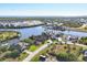 Scenic aerial shot showcasing waterfront homes, canals, and lush greenery in a peaceful residential community at 15172 Leipzig Cir, Port Charlotte, FL 33981