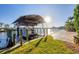 The property includes a private dock with boat lift and waterfront access at 15172 Leipzig Cir, Port Charlotte, FL 33981