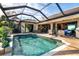 Expansive pool with screened enclosure and patio at 15172 Leipzig Cir, Port Charlotte, FL 33981