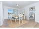 Charming dining room with a wooden table, six chairs, and access to a patio at 20 Annapolis Ln, Rotonda West, FL 33947