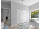 Bedroom featuring a double door closet and a view to the outdoors at 220 Mark Twain Ln, Rotonda West, FL 33947