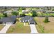 A charming single-Gathering home with a two-car garage and a well-manicured lawn near the canal at 220 Mark Twain Ln, Rotonda West, FL 33947