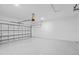 Clean, empty two-car garage with painted floor and white block walls at 220 Mark Twain Ln, Rotonda West, FL 33947