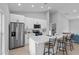 Bright kitchen features a large island with seating and modern appliances at 220 Mark Twain Ln, Rotonda West, FL 33947