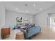 Inviting living space with tile flooring, comfortable sofas, and an abundance of natural light at 220 Mark Twain Ln, Rotonda West, FL 33947