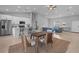 Open living space features modern kitchen, dining area, and living room with neutral color palette at 220 Mark Twain Ln, Rotonda West, FL 33947