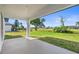 Covered patio with scenic backyard views at 220 Mark Twain Ln, Rotonda West, FL 33947